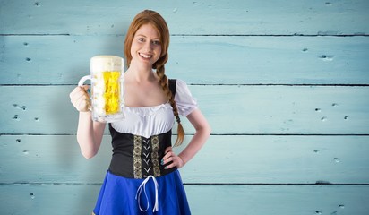 Smiling oktoberfest girl holding beer