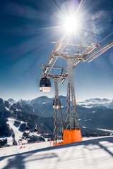 Chair or ski lift in snowy high mountains