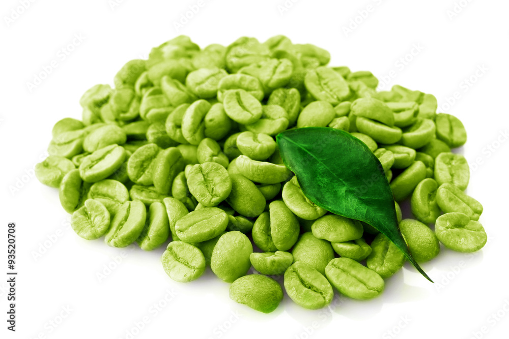 Canvas Prints Heap of green coffee beans with leaf isolated on white