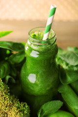 Green healthy juice with fruits and vegetables close up