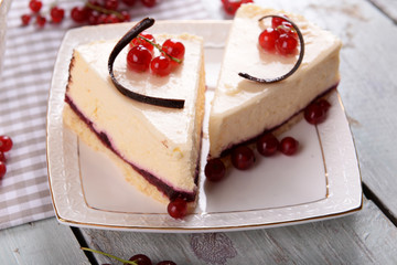Tasty cheesecake with berries on table close up
