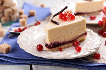 Tasty cheesecake with berries on table close up