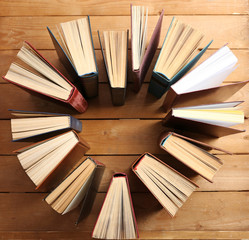 Heart of books, on wooden background
