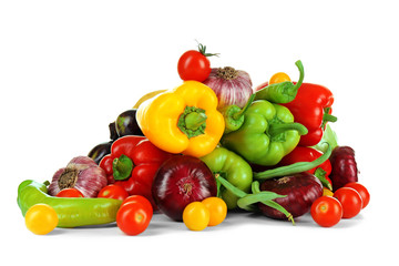 Heap of fresh vegetables isolated on white