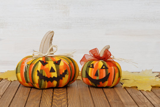 Two homemade smiling Halloween pumpkins
