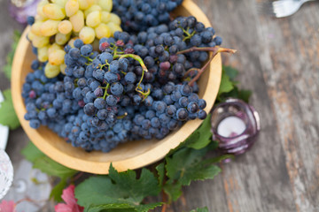 Grape outside on a wooden vintage background