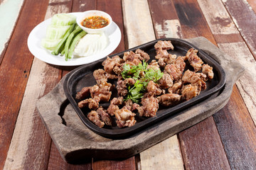 Deep fried pork with leech lime leaf and chili sauce