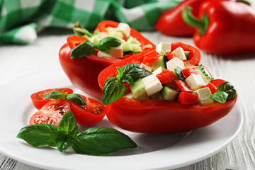 Fresh green salad in pepper on table close up