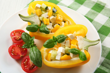 Fresh green salad in pepper on table close up