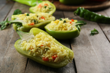 Stuffed peppers with vegetables on table close up