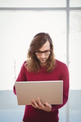 Man using laptop in office