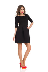 Fototapeta premium Sad Woman in Black Mini Dress