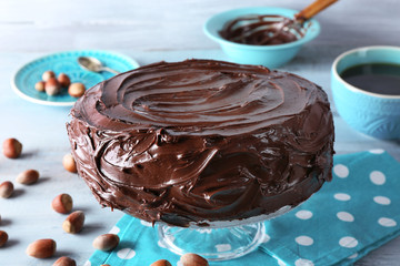 chocolate cake with hazelnuts and coffee on table