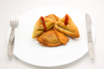 baked and fried keema samosa filled with boiled potato and mutton keema stuffiing - a traditional indian food for breakfast
