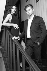 Couple in love on wooden stairs © Africa Studio