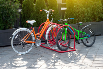 Row of parked colorful bikes on a street