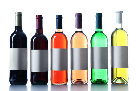 wine bottles in a row isolated on white background