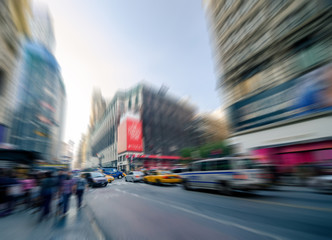 Blurry abstract photo in a city with people and vehicles