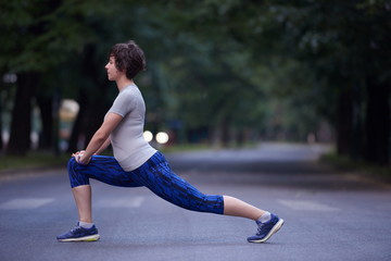 Fototapeta premium woman stretching before morning jogging