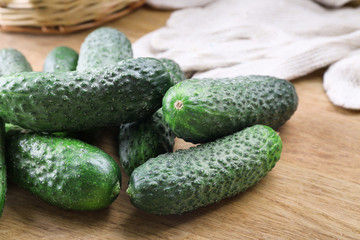 Ripe cucumbers on table closeup