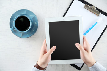 Man working with digital tablet, top view