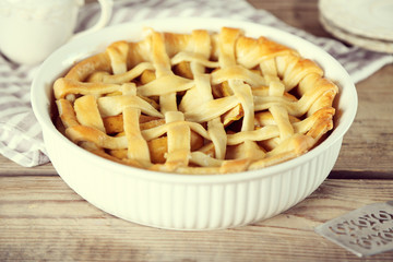 Homemade apple pie on wooden background