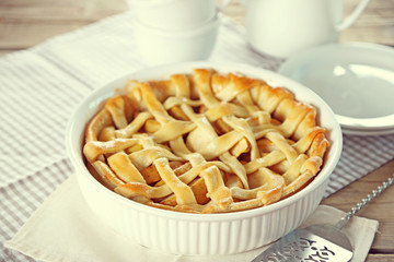 Homemade apple pie on wooden background
