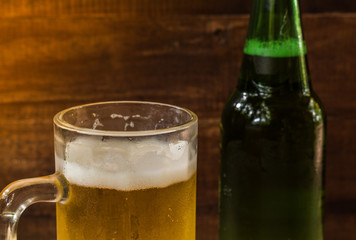 beer in glass on wooden background