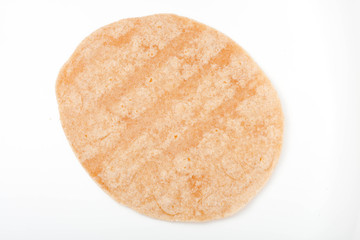 homemade whole wheat  mexican tortilla on white