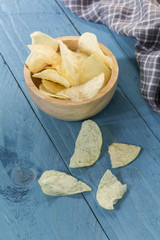 potato chips on wooden background