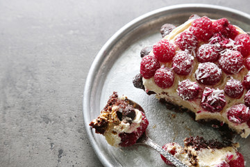 Sweet cake with raspberries on dark background