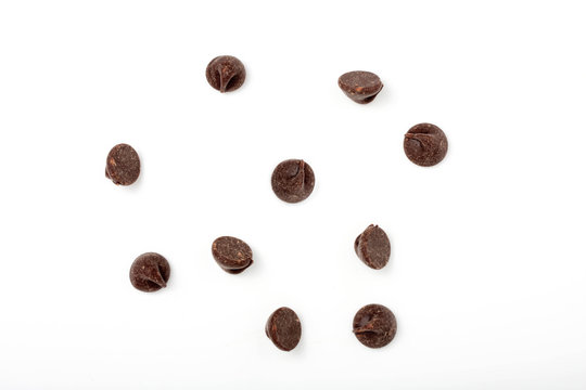 chocolate chips scattered on white background
