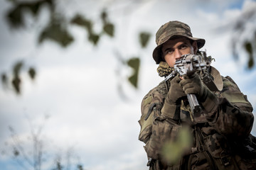 Fototapeta premium Army soldier with a weapon