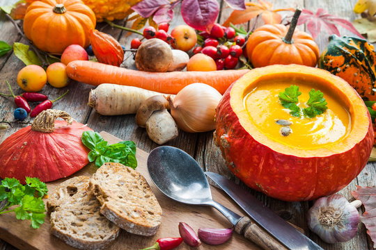 Pumpkin soup on a wooden table