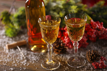 Champagne and Christmas decoration on wooden table