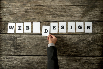 Overhead view of web designer assembling a Web design sign