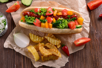 Hot dogs and vegetables on craft paper closeup