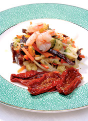 Appetizer with vegetables, dried tomatoes and prawns