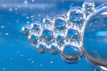 Blue bubbles in clear water.