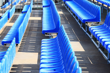 Obraz premium blue plastic seat in the street scene