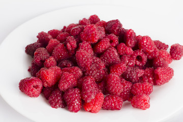 Raspberries on a white background