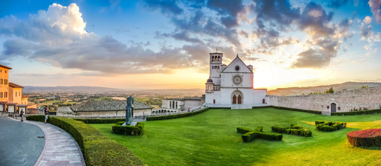 Amazing view of Basilica of St. Francis of Assisi at sunset, Umbria, Italy