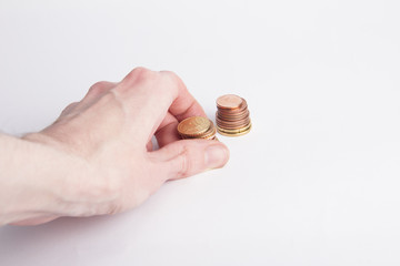 Hand and coins on white background