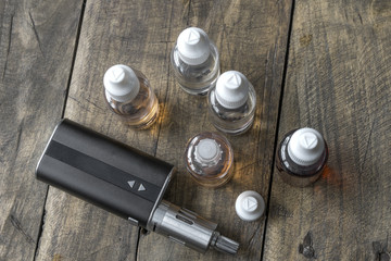 Obraz na płótnie Canvas e-cigarettes with different re-fill bottles