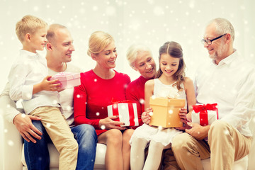 smiling family with gifts at home