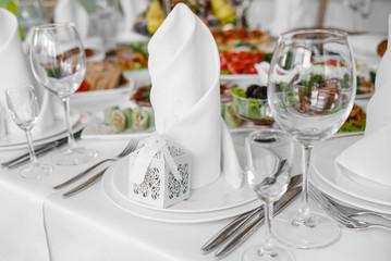 Banquet wedding table with dishware.