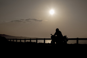moto riding silhouette  landscape at sunset