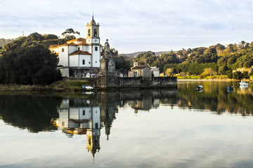 Fototapeta na wymiar Church and bay in the Spanish town of Niembro (Llanes-Asturias)