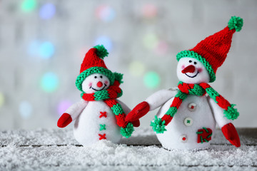Cute snowmen on Christmas background