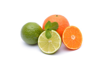 Limes and tangerines on white background